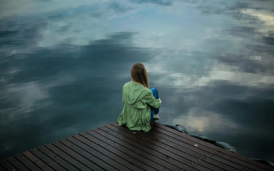 Woman Sitting on Wooden Planks