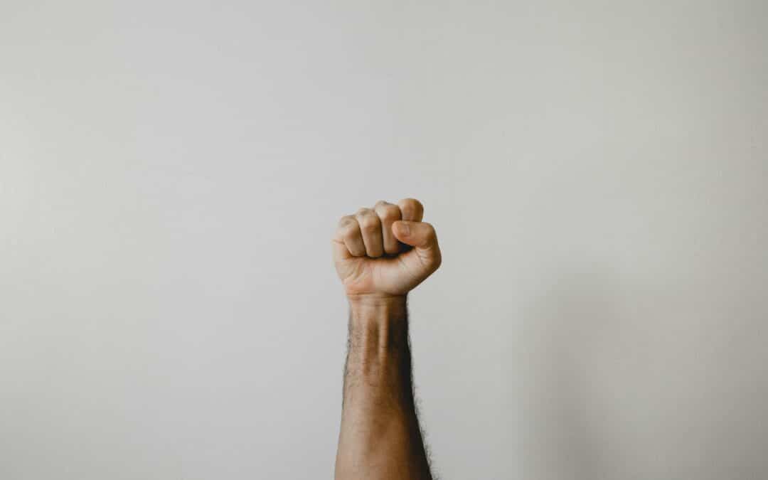 persons right foot on white wall