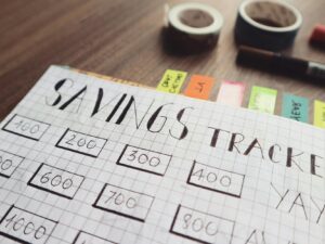 savings tracker on brown wooden surface
